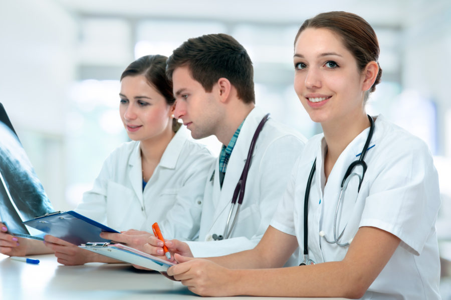 Group of doctors and nurses at a computer